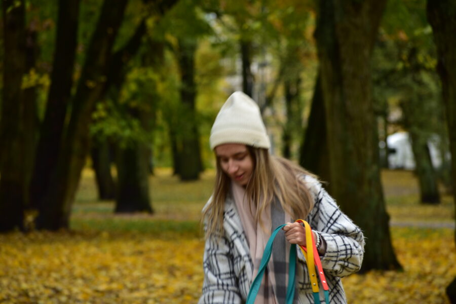 autumn colors, girl with hat and plaid coat with dog biothane leashes from bestdograincoats.com