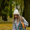 autumn colors, girl with hat and plaid coat with dog biothane leashes from bestdograincoats.com