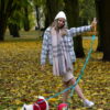 autumn colors, girl with hat and plaid coat with two westies and dog biothane leashes from bestdograincoats.com