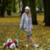 autumn colors, girl with hat and plaid coat with two westies and dog biothane leashes from bestdograincoats.com